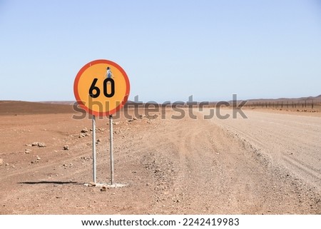 speed limit 60 road sign in the desert