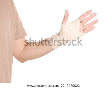 Man with hand wrapped in medical bandage on white background, closeup Royalty-Free Stock Photo #2242420023