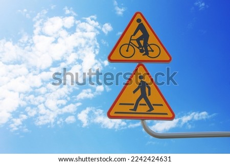 Signpost with Pedestrian Crossing Ahead and Cycle Route against clear sky, space for text