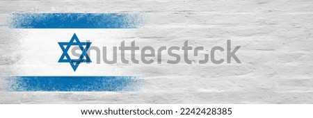 Flag of Israel. Flag painted on a white plastered brick wall. Brick background. Copy space. Textured creative background