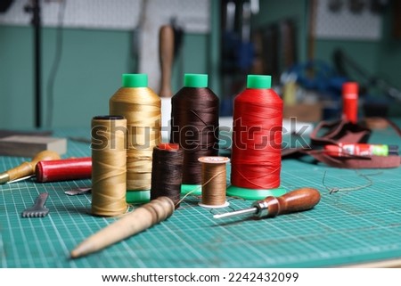 Leather Crafting Tools and Product Photos  Royalty-Free Stock Photo #2242432099