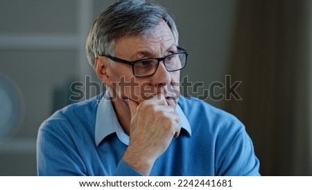 Portrait indoor in office home old thoughtful pensive confused senior man feel worried think memory problem take off glasses forgotten information, elderly old teacher look away anxious about trouble Royalty-Free Stock Photo #2242441681