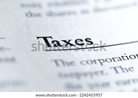 the word taxes written in business ethics textbook on United States law