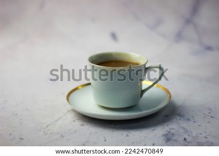 chocolate drink served in white cup. white background.