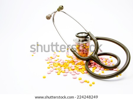 Medicine pills with stethoscope (Healthcare concept)