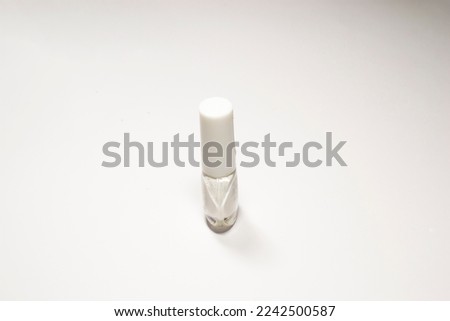 Bottle of pedicure polish on a white isolated background