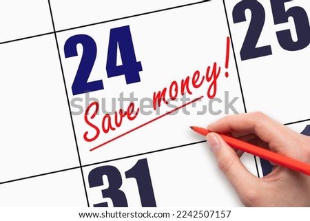 24th day of the month. Hand writing text SAVE MONEY and drawing a line on calendar date. A reminder of the last day. Deadline. Business concept Day of the year concept. Royalty-Free Stock Photo #2242507157