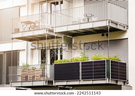 Solar Panels on Balcony of Apartment in Germany. Small Local Solar Panel Energy System on Balcony. Royalty-Free Stock Photo #2242511143