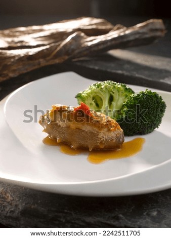 Braised Sea Cucumber with Minced Meat in Brown Sauce served in dish isolated on table top view of food