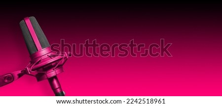Pink microphone on pink banner background with copy space