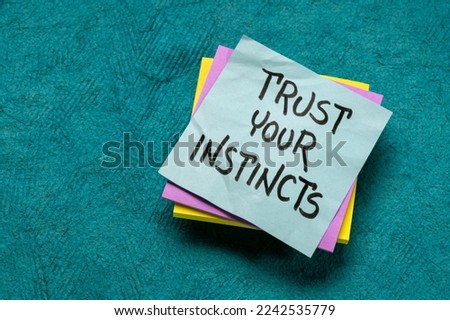 trust your instincts  - advice or motivational reminder on a sticky note, confidence and personal development concept Royalty-Free Stock Photo #2242535779