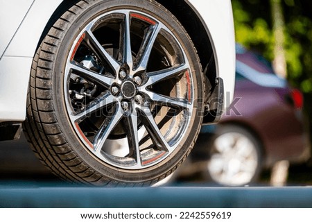 sports car wheels, low profile tires on aluminum rims, close-up, selective focus
