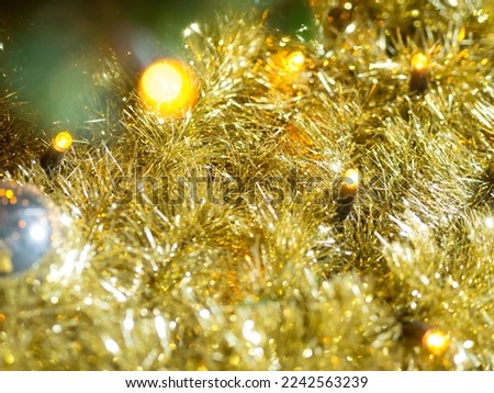 Abstract christmas background in bokeh. Yellow lights of blinking garland in blur. Unsharp bulbs of Christmas decorations. Festive mood. Background for text or pictures. New Year holiday