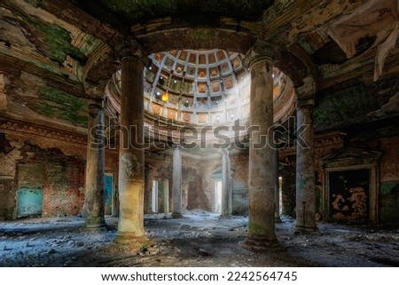 Interior of old ruined palace with columns and dome. Royalty-Free Stock Photo #2242564745
