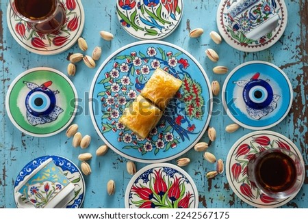 Photograph of Turkish Baklava in Ottoman Tile Turkish Coffee Cup and Turkish Tea Concept, Uskudar Istanbul, Turkey Royalty-Free Stock Photo #2242567175