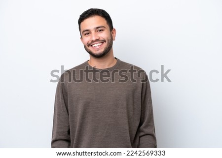 Young Brazilian man isolated on white background laughing Royalty-Free Stock Photo #2242569333