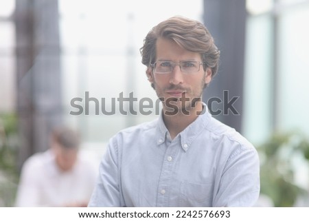 close-up portrait of a young successful businessman in the office