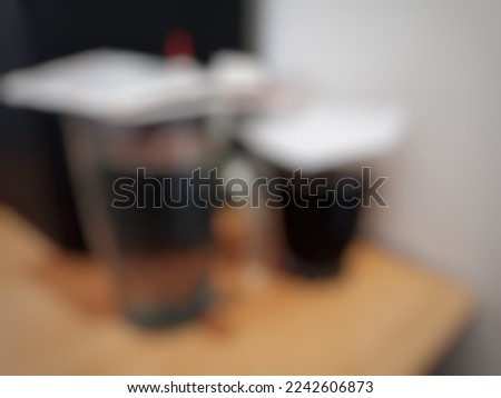 Photography with a defocused theme with white water and coffee objects