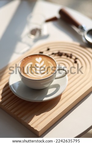 hot latte with latte art Royalty-Free Stock Photo #2242635795