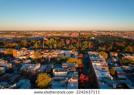 Aerial Drone View of Baltimore City Houses and Fall Foliage Trees at Sunset