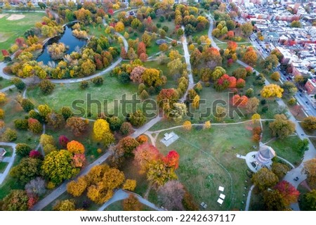 Aerial Drone View of Baltimore City Houses and Fall Foliage Trees at Sunset