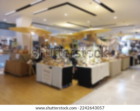 Blurred image of the atmosphere of the flea market in the mall.