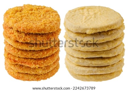 Stacks of semifinished frozen chicken and fish cutlets Royalty-Free Stock Photo #2242673789
