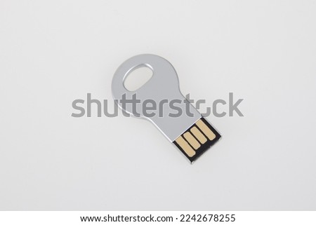 USB Key silver Flash Drive grey Stick Memory steel on white desk background