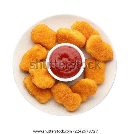 Tasty chicken nuggets with ketchup isolated on white, top view Royalty-Free Stock Photo #2242678729