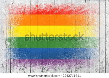 Flag of LGBT. Flag is painted on a white wooden surface. Wooden background. Plywood surface. Copy space. Textured creative background