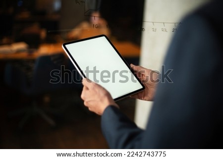 Close up of man using digital tablet