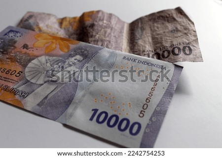old and new editions of Indonesian currency. Isolated on white background. Money of Indonesia. Collection of the Indonesian rupiah new 2022 edition banknotes