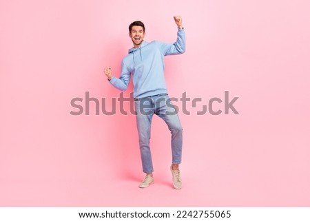 Full body size photo of excited man win his bet victory football team raise fists up hooray celebrate extra reward isolated on pink color background Royalty-Free Stock Photo #2242755065