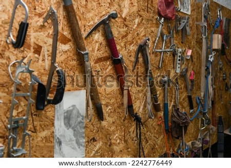 Old climbing equipment on the wall.