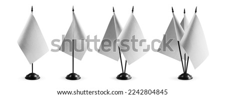 A set of small white flags on a white background.