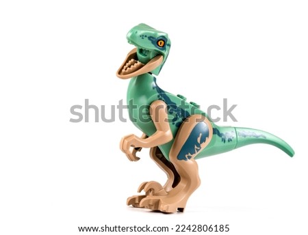 green dinosaur toy on white background
