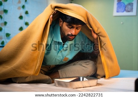 sick man taking inhaling menthol steam vapour to get relief from cough on bed - conept of pain relieve, home remedies, therapy Royalty-Free Stock Photo #2242822731