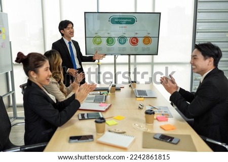 Employee meeting big screen tv presentation conference discussion brainstorming and working together