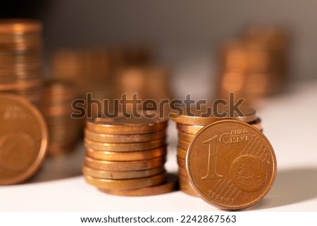 Metal money, cents are counted on the table, white background.