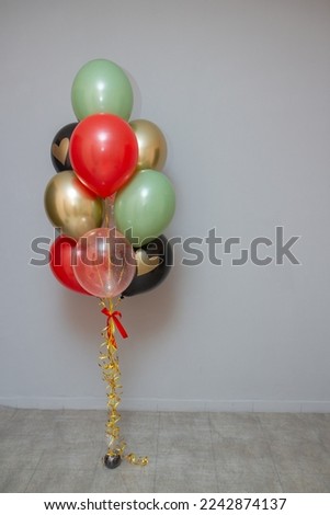 set of gold and red birthday balloons