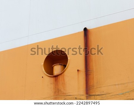 Tug area sign on ship hull.