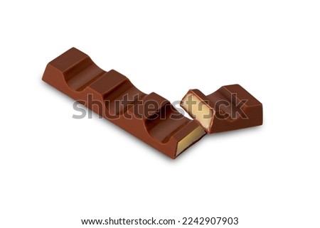 Chocolate bar cut with a view of the milk cream filling, isolated on white, copy space, clipping path