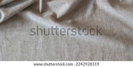 Abstract crumpled linen fabric texture background. Natural solid linen organic eco textiles canvas background. Top view