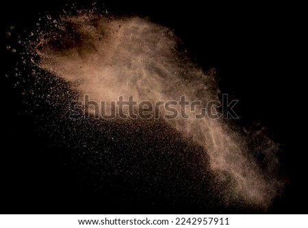 Sandy Explosion Isolated On Over Dark Background Royalty-Free Stock Photo #2242957911