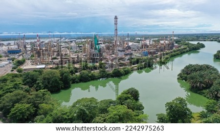 View from a drone of an oil refinery on the banks of the Magdalena river in the city of Barrancabermeja. Colombia. Royalty-Free Stock Photo #2242975263