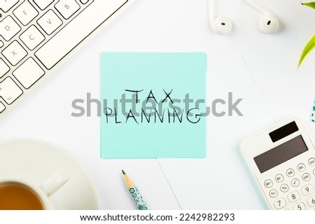 Hand writing sign Tax Planning. Business showcase analysis of financial situation or plan from a tax perspective