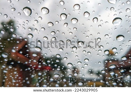 Blurred image of a raindrops on the windshield.  