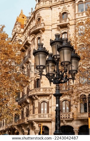 Modernist street lamp next to Modernist building in Barcelona, Spain