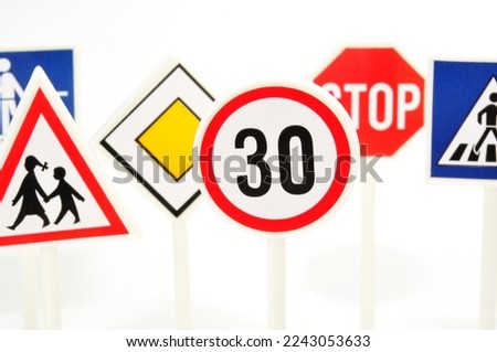 Colorful plastic road signs on white background, isolated.