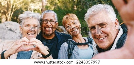 Nature, selfie and senior friends hiking together in a forest while on an outdoor adventure. Happy, smile and portrait of a group of elderly people trekking in woods for wellness, health and exercise Royalty-Free Stock Photo #2243057997